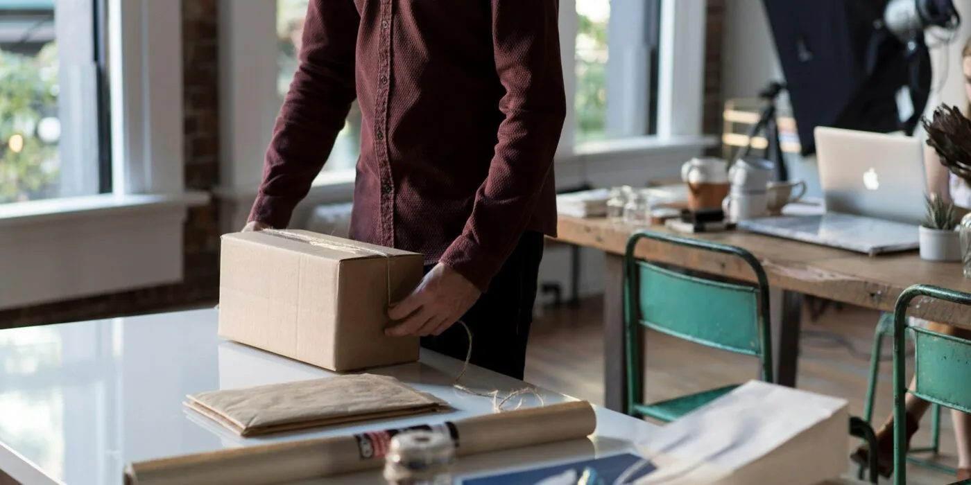 Customer monitoring shipping status on phone during holiday season